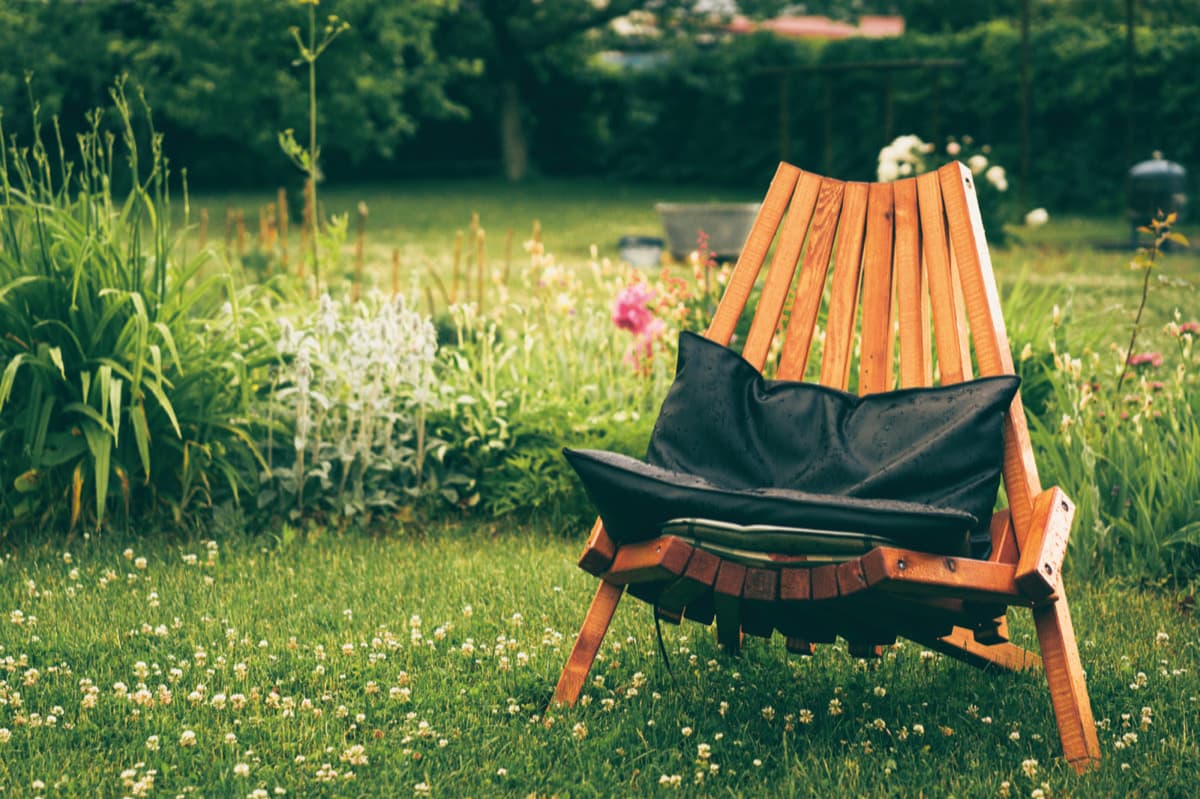 Outdoor timber chair protected against rain