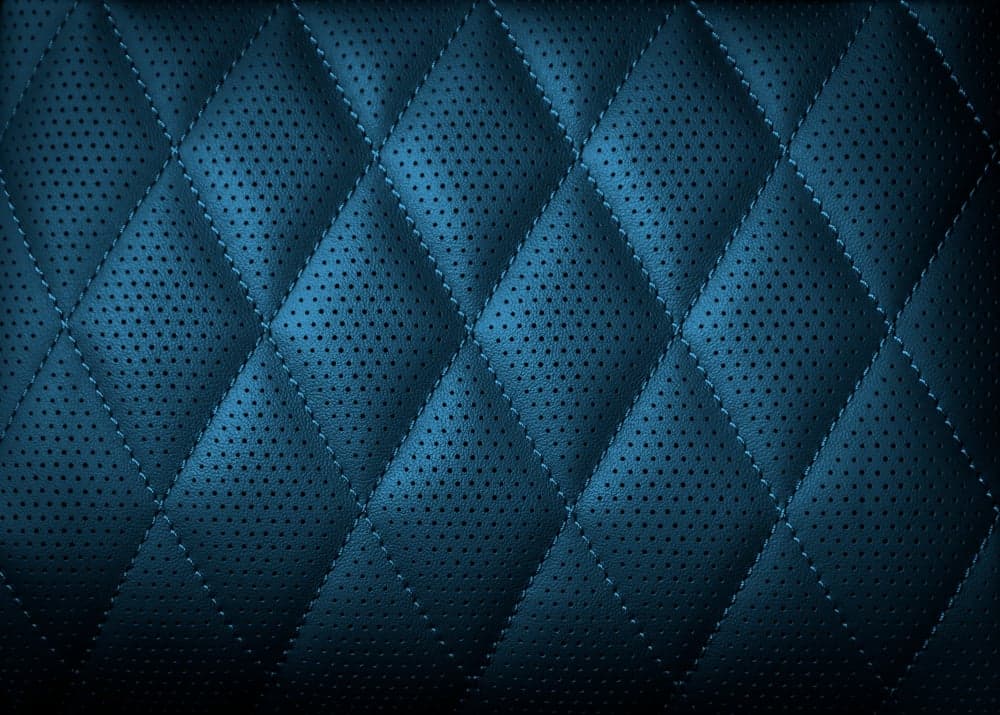 Detail of dark blue stitched leather upholstery