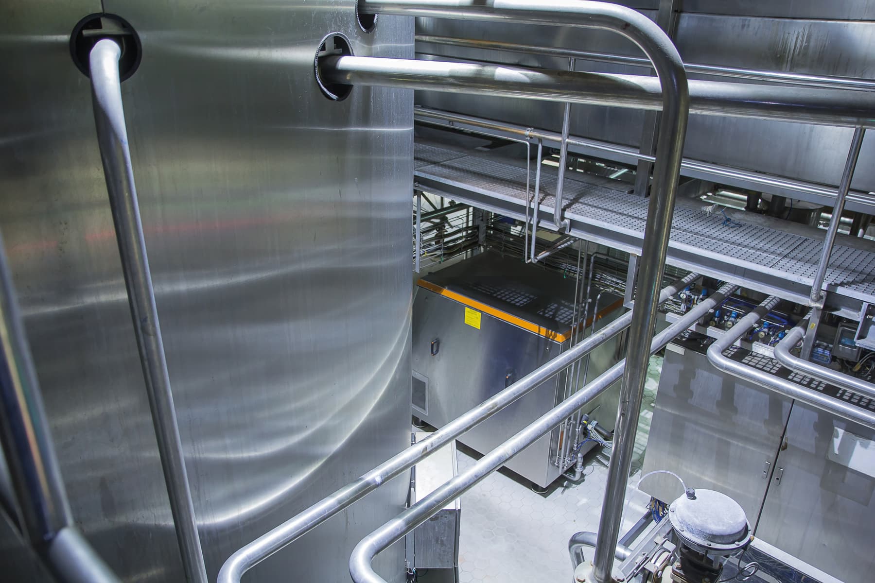 Stainless steel tanks and pipework in an industrial facility